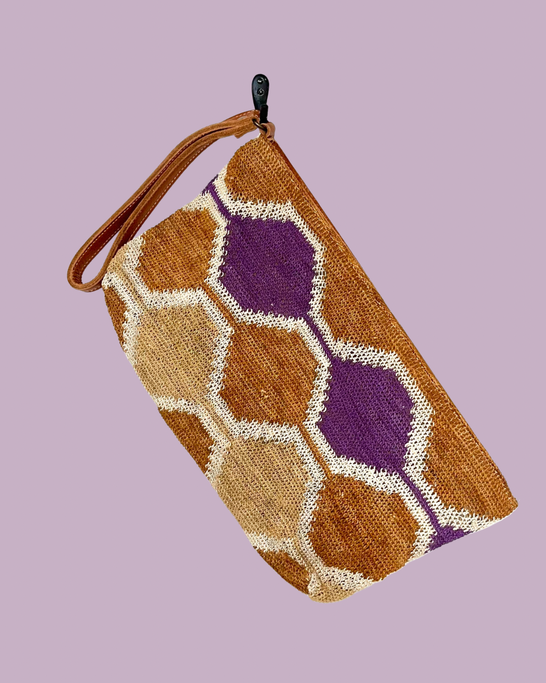 Leather clutch with handwoven chaguar (plant fibre) details. Made ethically from indigenous women artisans in Argentina.