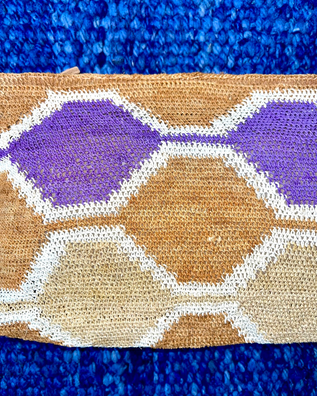 Leather clutch with handwoven chaguar (plant fibre) details. Made ethically from indigenous women artisans in Argentina.