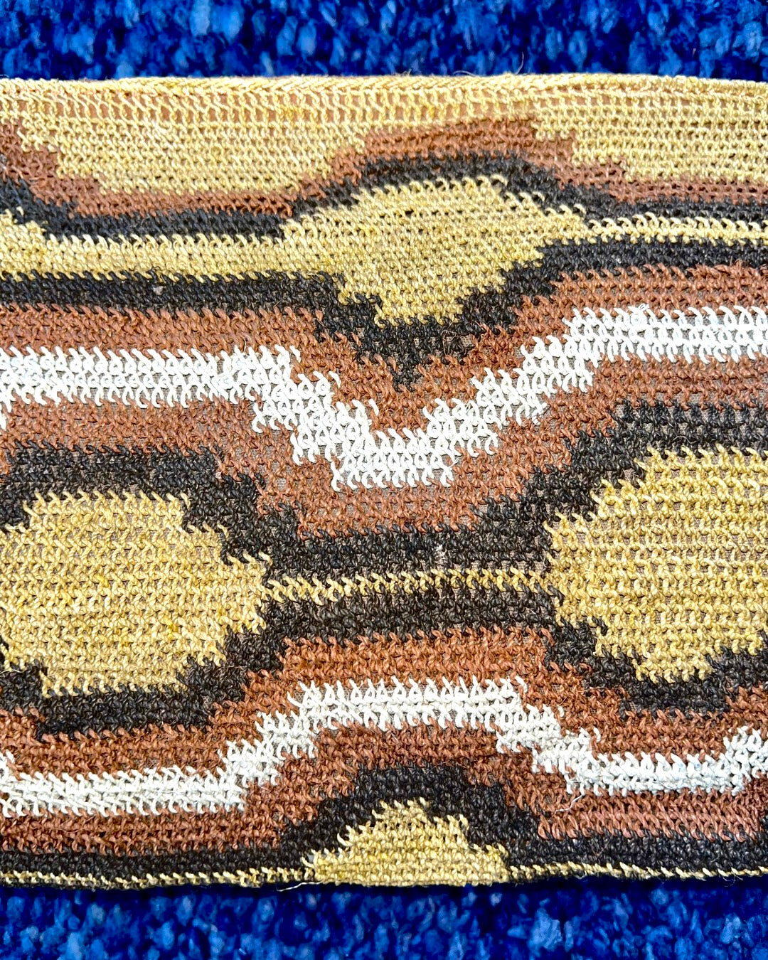 Leather clutch with handwoven chaguar (plant fibre) details. Made ethically from indigenous women artisans in Argentina.